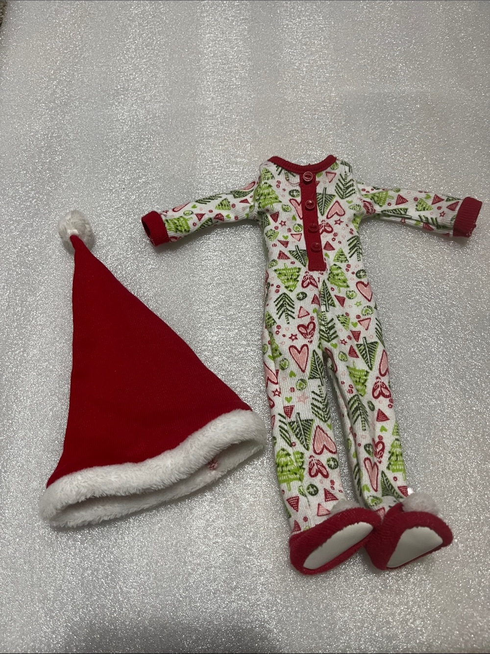 American Girl doll outfit is the Hearts and Pines Holiday PJ and red hat